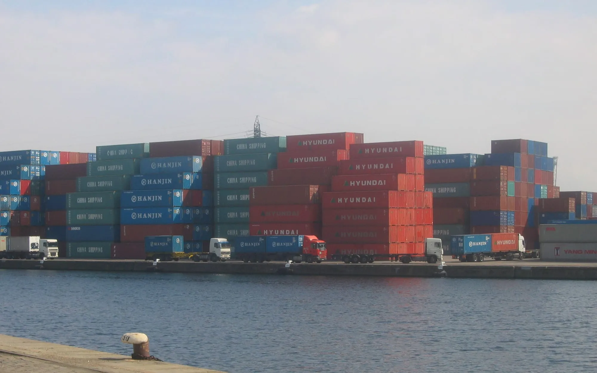 Stacks of shipping containers at a port terminal awaiting clearance