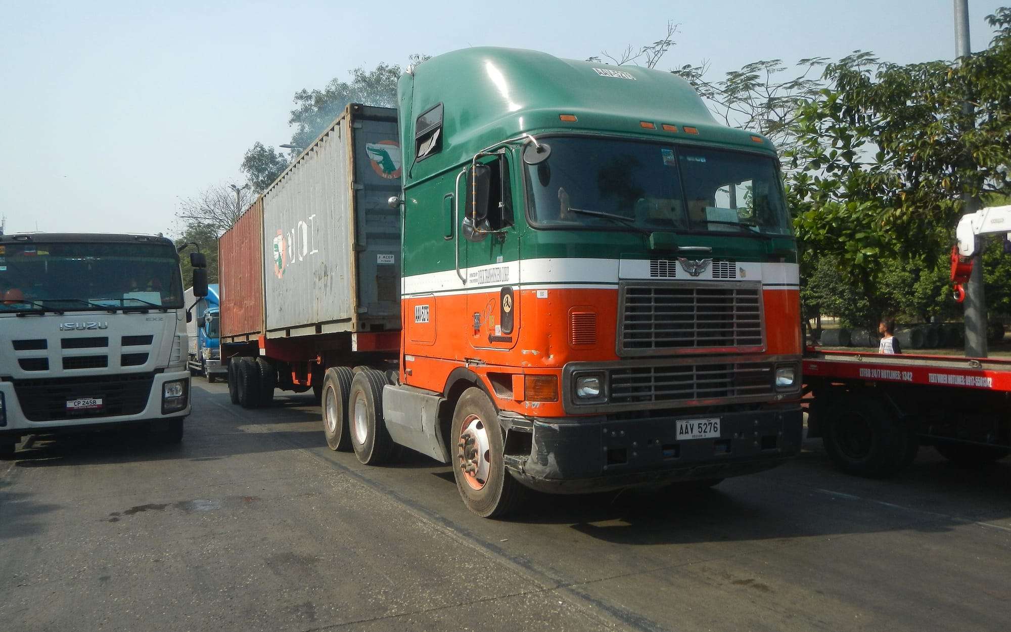 Container truck and trailer on a road in a port area